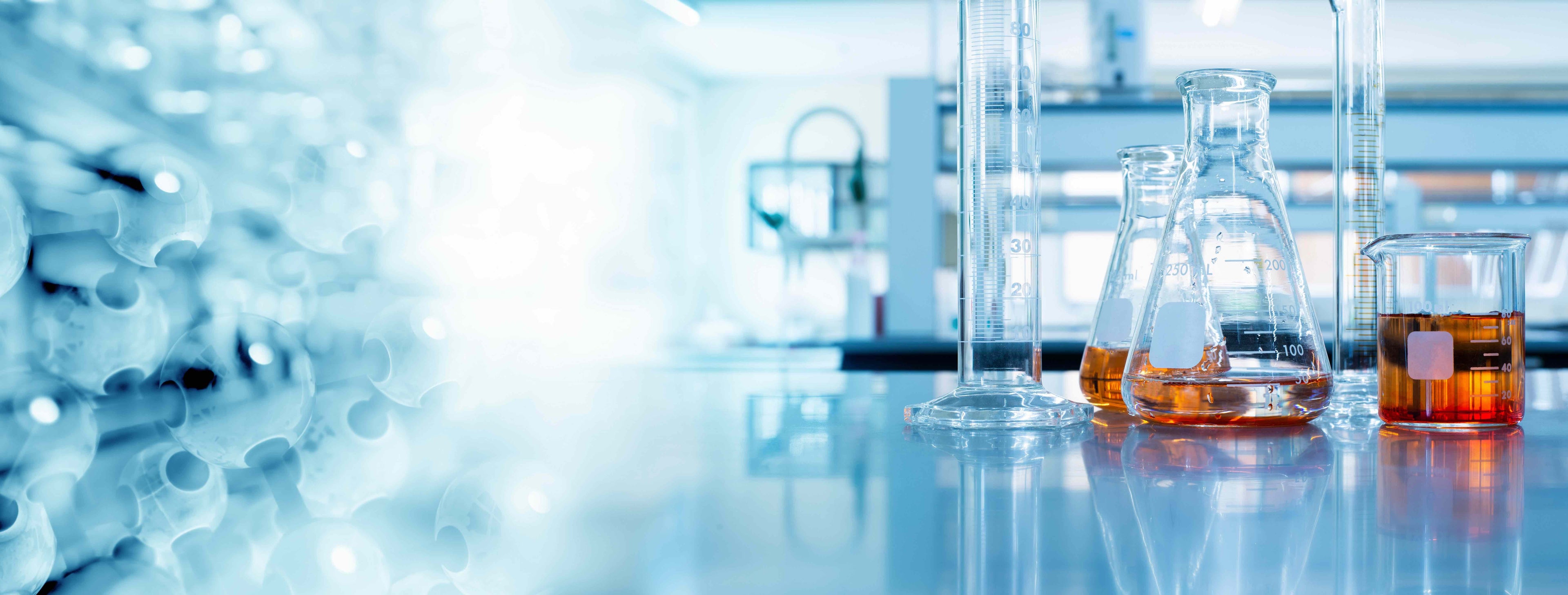 Laboratory setting with beakers and a blurred background